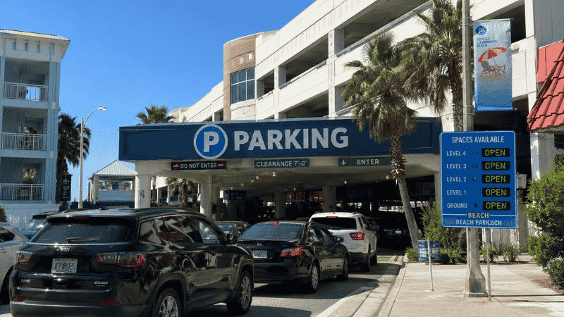 Cars lined up at a busy beach parking garage entrance in Clearwater Beach Florida