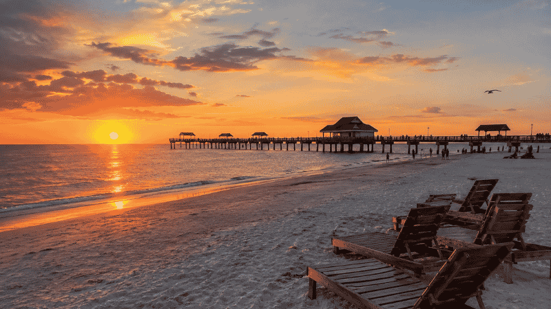 Clearwater Beach Florida at sunset with Pier 60 and calm Gulf water