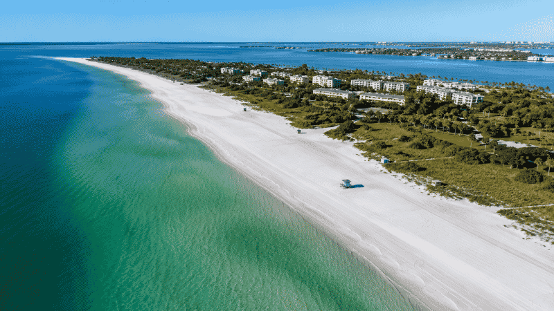 Aerial view of Siesta Key Beach Florida with wide white quartz sand and calm turquoise Gulf water