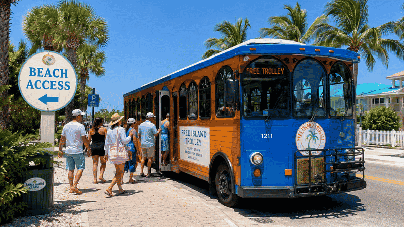 Free Island Trolley bus stopping at a beach access point on Anna Maria Island Florida with passengers boarding