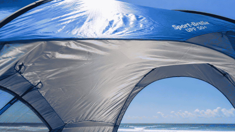 Close up of beach tent canopy showing silver reflective UPF 50 plus lining on the underside for UV protection