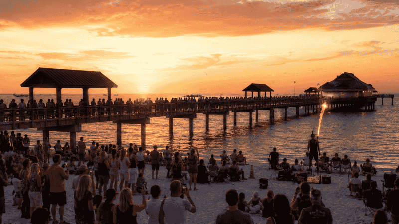 Pier 60 Clearwater Beach Florida at golden sunset with crowd gathering for the nightly Sunset Festival
