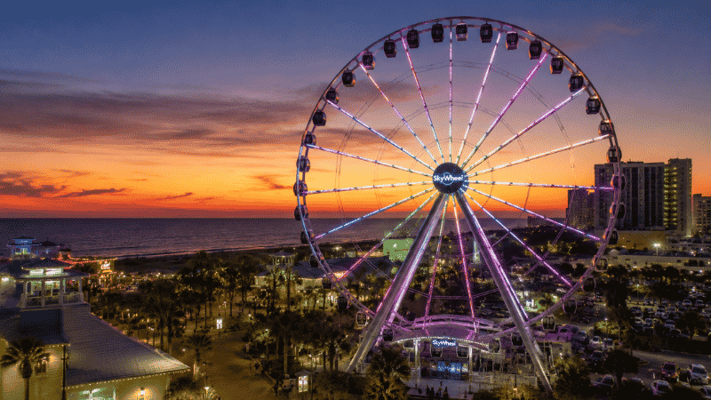 SkyWheel observation wheel at Pier Park Panama City Beach Florida at dusk with Gulf of Mexico in background