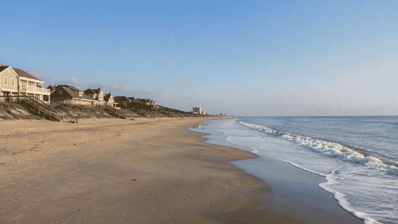 Quiet uncrowded Golden Mile section of Myrtle Beach north of 31st Avenue with wide sandy beach and few visitors on a peaceful morning